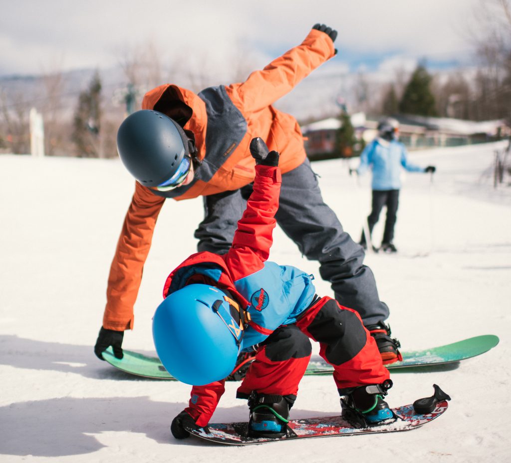 Kid and Dad on Snowboards