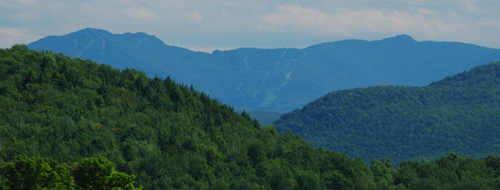 Spring view of mountains and trails at Smugglers' Notch
